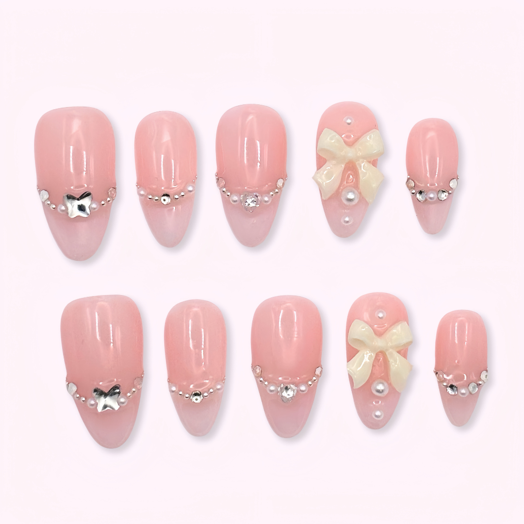 Pinkie Promise Nails Press-Ons Reusable Best Press-on Nails Salon Quality Nails at home Aalyah Medium Almond Press-On Nails, Set of pink nail art designs with bows pearls and jewels