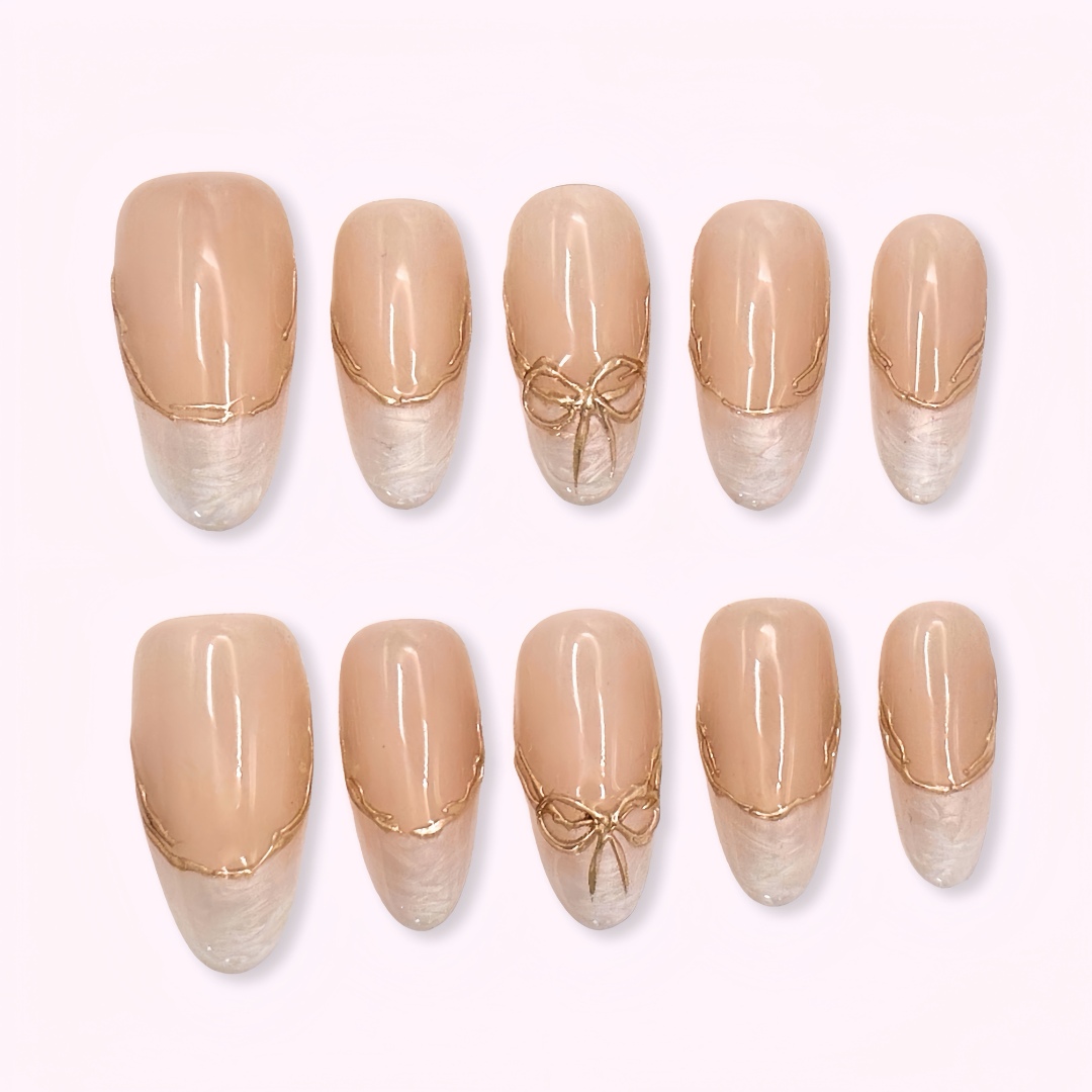 Pinkie Promise Nails Press-Ons Reusable Best Press-on Nails Salon Quality Nails at home Valentina Medium Oval Press-On Nails Set of beige nail extensions with decorative bows