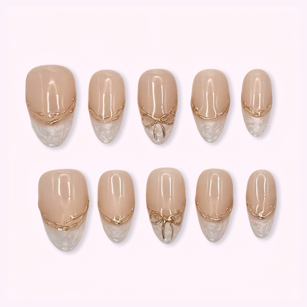 Pinkie Promise Nails Press-Ons Reusable Best Press-on Nails Salon Quality Nails at home Valentina Medium Oval Press-On Nails Set of beige and gold nail designs on a white background